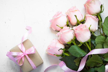 Pink rose at white stone table.