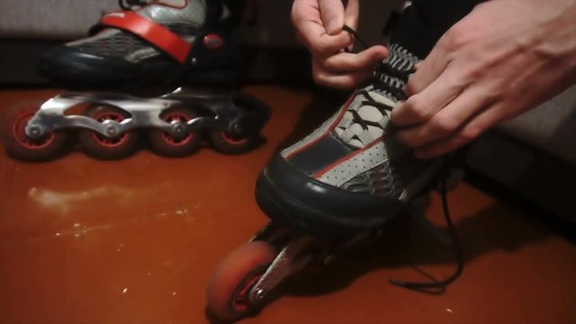 tying of laces on roller skates.