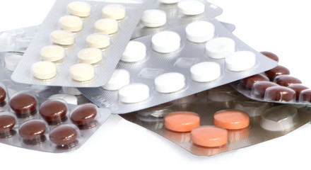Fototapeta na wymiar different pills in blisters, macro