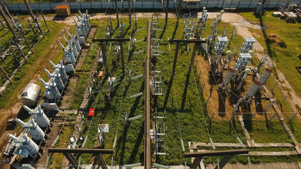 Aerial view Power plant, transformation station, cables and wires. High voltage electric power...