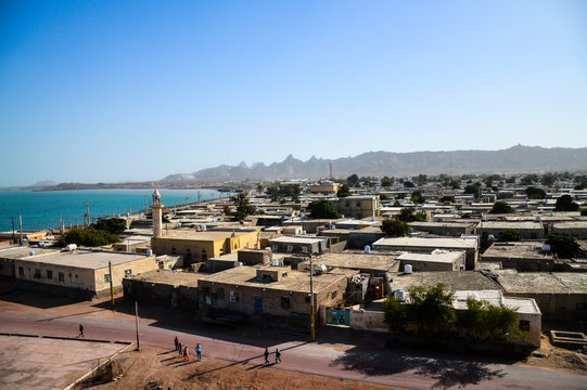 Hormoz, Iran - December 11, 2015: Unidentified people on the street of Hormoz town on Hormoz island in Persian Gulf, Iran - aerial view