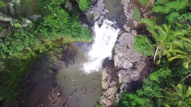Cinematic aerial of a popular hidden waterfall just outside of Ubud
