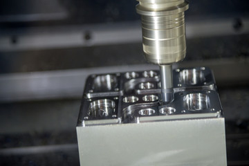 The CNC milling machine cutting the sample part.The tool length measurement on CNC machine.