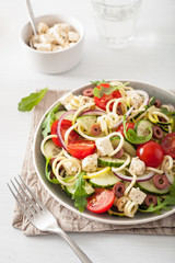 spiralized courgette salad greek style with tomato feta olives cucumber