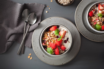 granola and yogurt with seeds and strawberry for breakfast