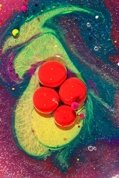 Little balls of Airbrush-Ink in liquid paraffin forming amazing abstract picturs