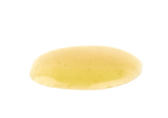 Puddle of the yellow hot sauce isolated
