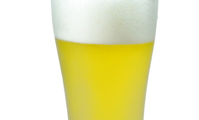 cold beer with frothy in glass on white background