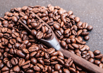 Coffee beans in wooden spoon