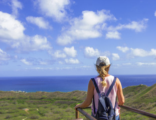 Female looking out at the Honolulu city view.