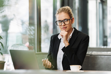 Thoughtful blonde business woman