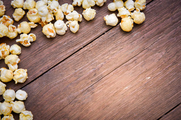 popcorn texture on a wooden table blackground