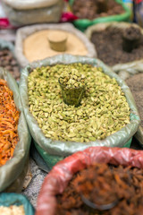 Close-up cardamon and other spices on indian market stall