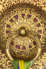 Beautiful golden door handle in the Rumtek Monastery in Gangtok, india. Architecture detail close-up