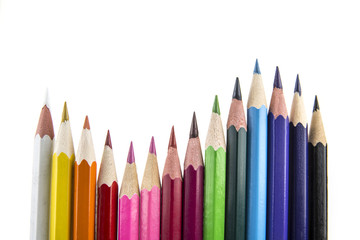 Sharpened colored pencils on the white background