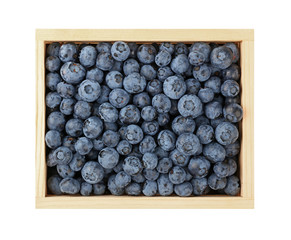 Close up wooden box of fresh blueberries