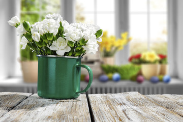 Easter table background and blurred window space 