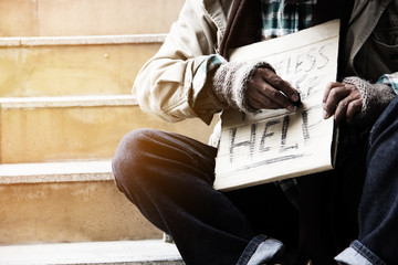 Homeless man on walkway street in the city.