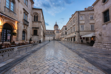 Fototapeta na wymiar Old City of Dubrovnik, amazing view of medieval architecture along the stone street, tourist route in historic center. The world famous and most visited city of Croatia, UNESCO World Heritage site