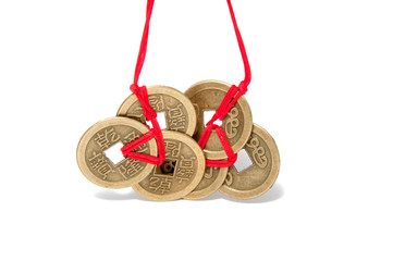 three chinese lucky coins with red knot on the white