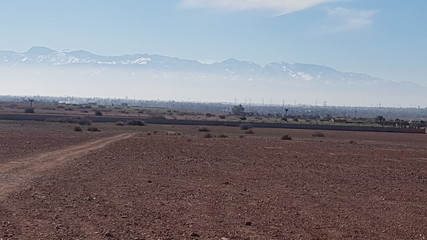 Fototapeta na wymiar Atlas Mountains of Morocco in background of Land