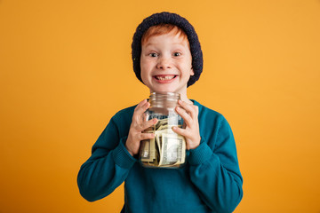Funny little redhead boy with freckles