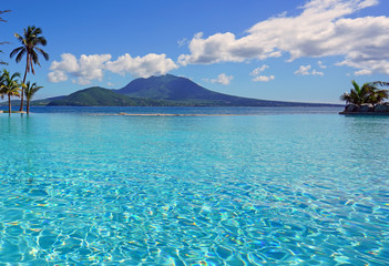 View of the Nevis Peak volcano from a swimming pool in Christopher Harbour, St Kitts 