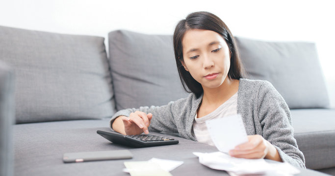 Woman counting expense of daily life