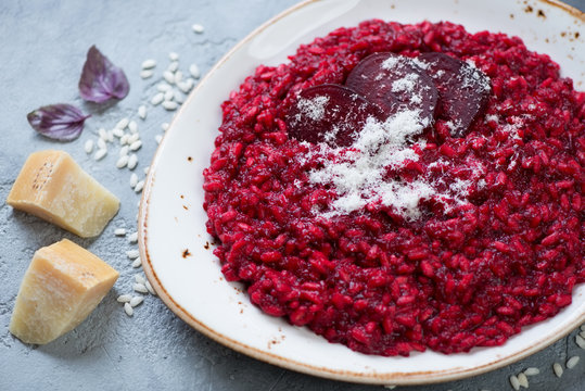 Close-up of risotto with beetroot and parmesan, selective focus, horizontal shot