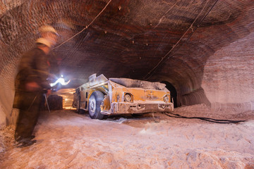 Fototapeta na wymiar Underground salt ore mine shaft tunnel gallery continuous miner machine