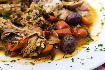 juicy pork leg with fresh olives