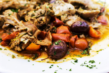 juicy pork leg with fresh olives