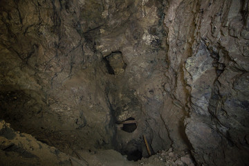 Underground abandoned ore mine shaft tunnel gallery huge cavern cavity