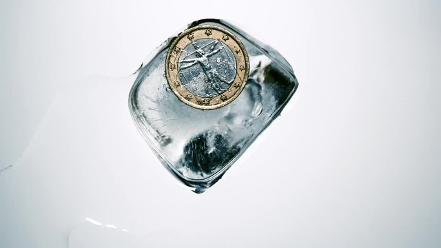 Da Vincis "Vitruvian man" on an euro coin covered with ice