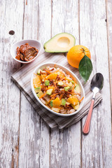 salad with avocado orange beans carrots and dried tomatoes