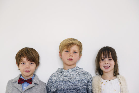 Portrait of three children ready for a party