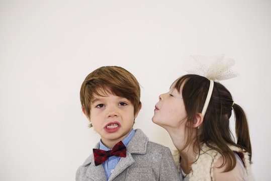 Girl trying to kiss a boy