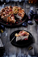 Plum pie, charlotte with plums in a cut