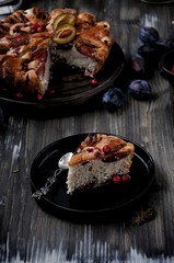 Plum pie, charlotte with plums in a cut