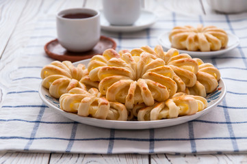 Pineapple ringlets in puff pastry, baked in the form of flowers
