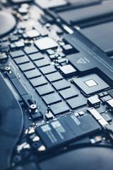 Closeup view to motherboard of modern laptop with chips and othen components