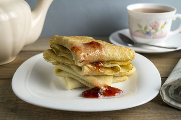 Pancakes with jam and tea
