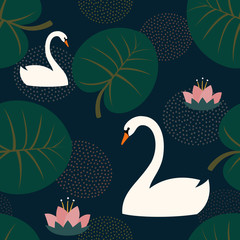 Fototapeta premium Trendy seamless pattern with white swans, water lily and leaves on dark blue background. Night lake art background. Fashion design for fabric, wallpaper, textile and decor.