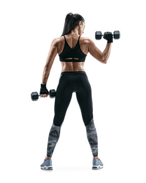 Strong woman working out with dumbbells, flexing her arm. Photo of sporty woman in sportswear on white background. Rear view. Full length