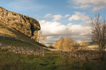 Kilnsey Crag / The 40 ft overhang of the 180 ft Kilnsey Crag in Upper Wharfedale, Yorkshire Dales village of Kilnsey, England. 24 November 2017