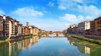 Fototapeta na wymiar Famous landmark of Florence is the Bridge Trinity. Renaissance bridge over river Arno. Italy, June 2017. Ponte Santa Trinita.