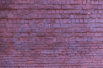 Background of old vintage dirty brick wall with peeling plaster, texture