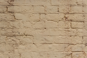 Obraz premium Background of old vintage dirty brick wall with peeling plaster, texture