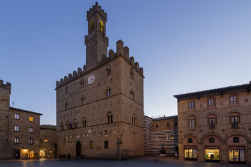 Priori Palace and Square in the evening blue light, Volterra, Pisa, Tuscany, Italy