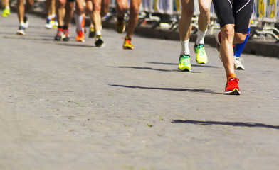 Detail of a group of runners during a city marathon